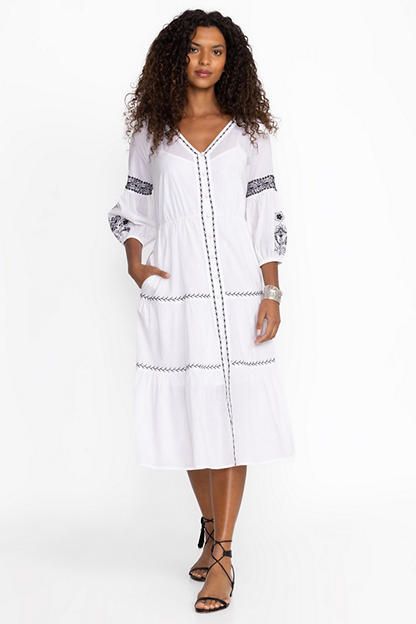 Crafted from 100% breathable cotton, the Cam Tiered Midi Dress offers a distinctly feminine silhouette enhanced with intricate placement embroidery. Featuring a V-neckline with a button front, this slip-lined midi dress is finished with an elastic waist and flowing tiered skirt. Pair with espadrille wedges and classic sunglasses for brunch by the beach. Johnny Was Women's Cam Tiered Midi Dress in White, Size PS, Cotton Placement Embroidery, Bohemian Clothes Women, Kate Middleton Outfits, Boho Chic Outfits, Classic Sunglasses, Tiered Midi Dress, Feminine Silhouette, By The Beach, Peasant Tops