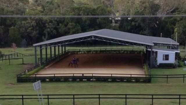 an aerial view of a horse riding arena