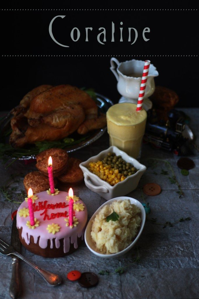 there is a birthday cake with candles on it and other food items around the table