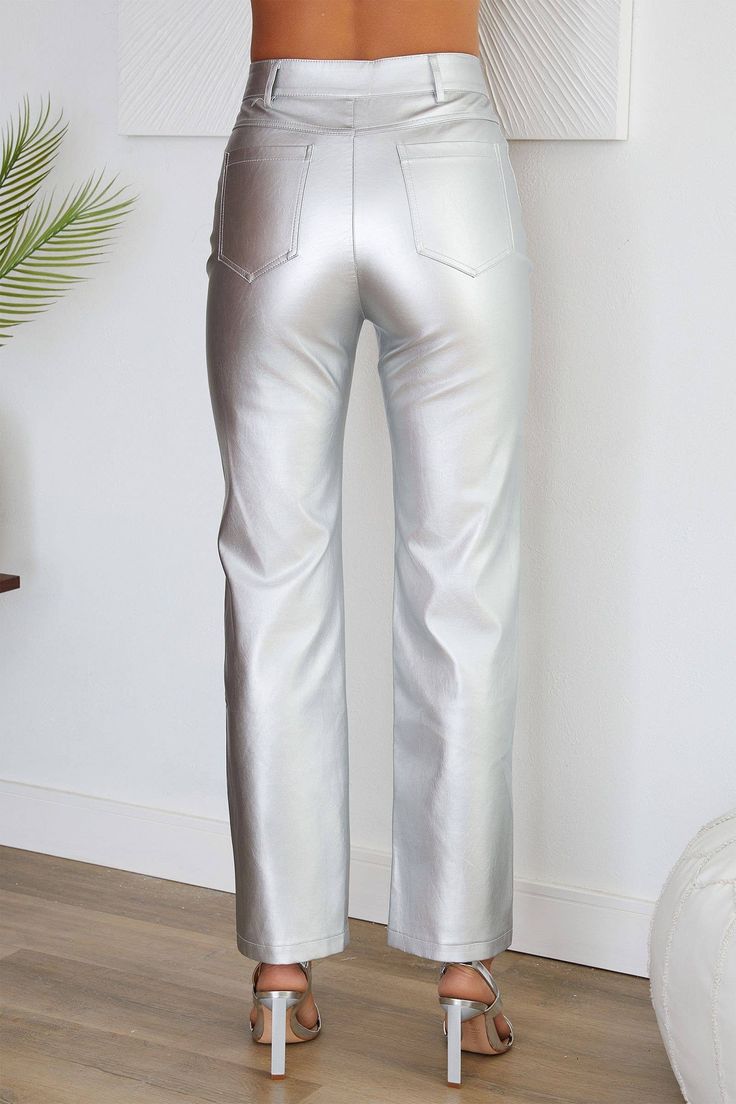 Indulge in the allure of contemporary elegance with our Luna Silver Vegan Leather Pants. The front button and zipper detailing accentuate the straight-leg silhouette, offering a sophisticated yet stylish appeal that effortlessly commands attention. Meticulously crafted with exquisite details, these vegan leather pants are designed to provide a comfortable fit while making a bold statement. The polyurethane fabric not only adds a luxurious sheen but also ensures a lasting impression, making these Chic Metallic Leather Pants For Spring, Modern High Waist Leather Pants, Chic Metallic Leather Pants For Fall, Metallic Straight Leg Leather Pants For Night Out, Chic Straight Bottoms For Fall, Chic Straight Pants, Modern Straight Leather Pants, Sleek Metallic Bottoms, Faux Leather Straight Leg Jeans For Work