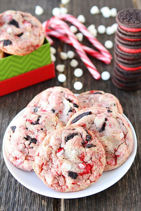 peppermint chocolate chip cookies on a plate with candy canes in the background