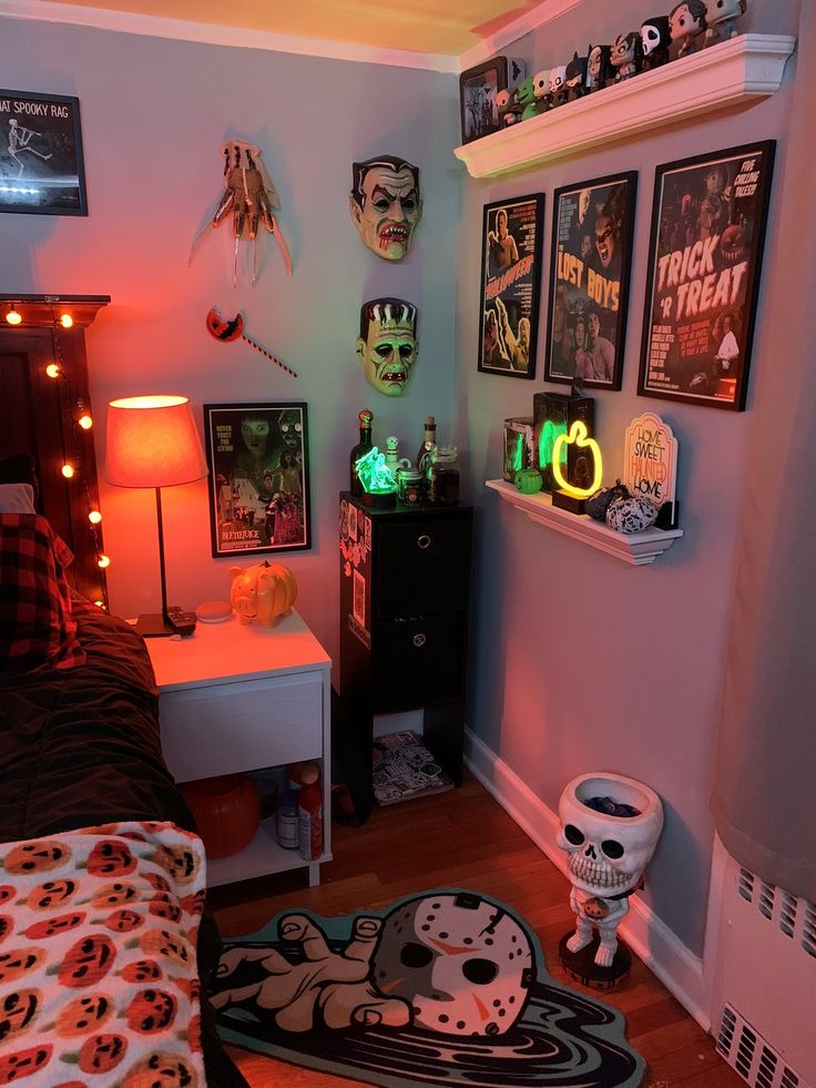 a living room filled with lots of halloween decorations and decor on the wall above it