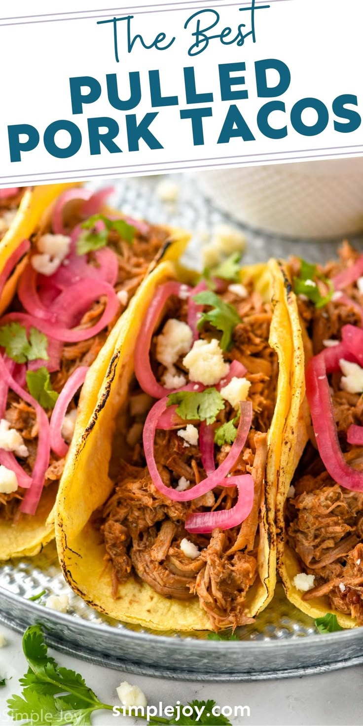 three pulled pork tacos on a plate