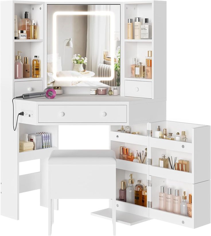 a white vanity with drawers and shelves filled with beauty products, including an illuminated mirror