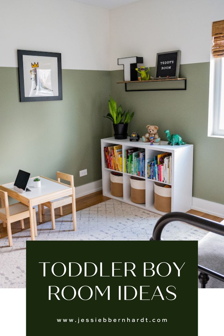 Sage green toddler boy's room with white bookshelf and books organized in rainbow color. Boys Room Toddler Bed, Little Boy Shared Bedroom Ideas, Kids Green Bedroom Ideas, Painted Boys Room, Half Wall Paint Ideas Bedrooms, Boys Toy Room Ideas, Board And Batten Toddler Room, Two Year Old Bedroom Boy Rooms, Preschooler Bedroom Ideas