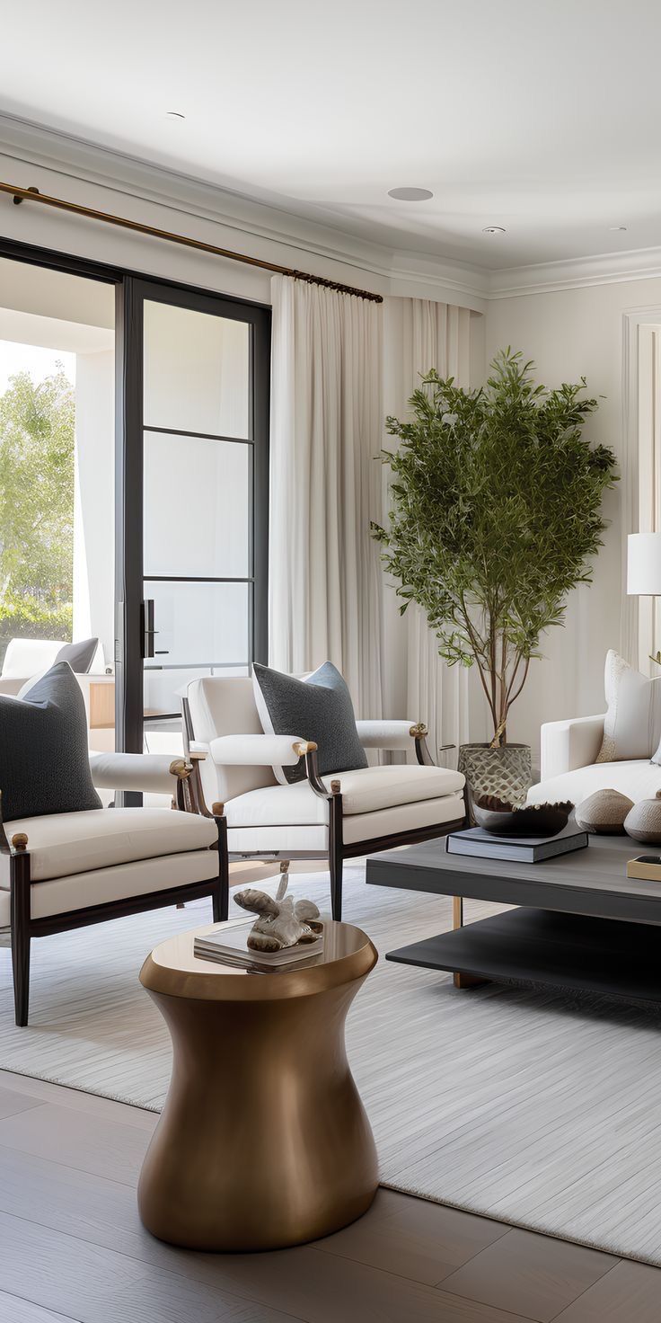 a living room filled with furniture and a potted plant on top of a table