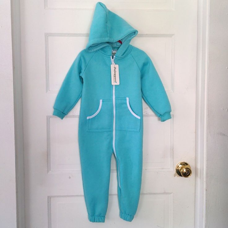 Small Fleece Lined Jumpsuit With Front Pockets And Hood. 30 Inches Long. 12.5 Inch Inseam. About 11 Inch Sleeves. Casual Stretch Onesie For Playwear, Blue Fleece Tracksuit For Loungewear, Blue Cotton Onesie For Loungewear, Casual Onesie For Sleepovers, Blue Hooded Onesie For Winter, Blue Cotton Hooded Tracksuit, Blue Hooded Cotton Tracksuit, Blue Hooded Winter Onesie, Blue Onesie For Winter Sleepover