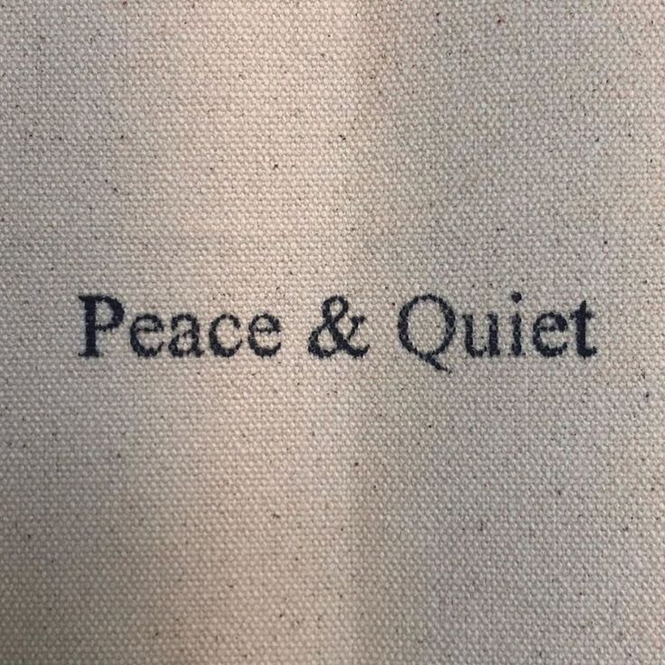 the word peace and quiet written in black ink