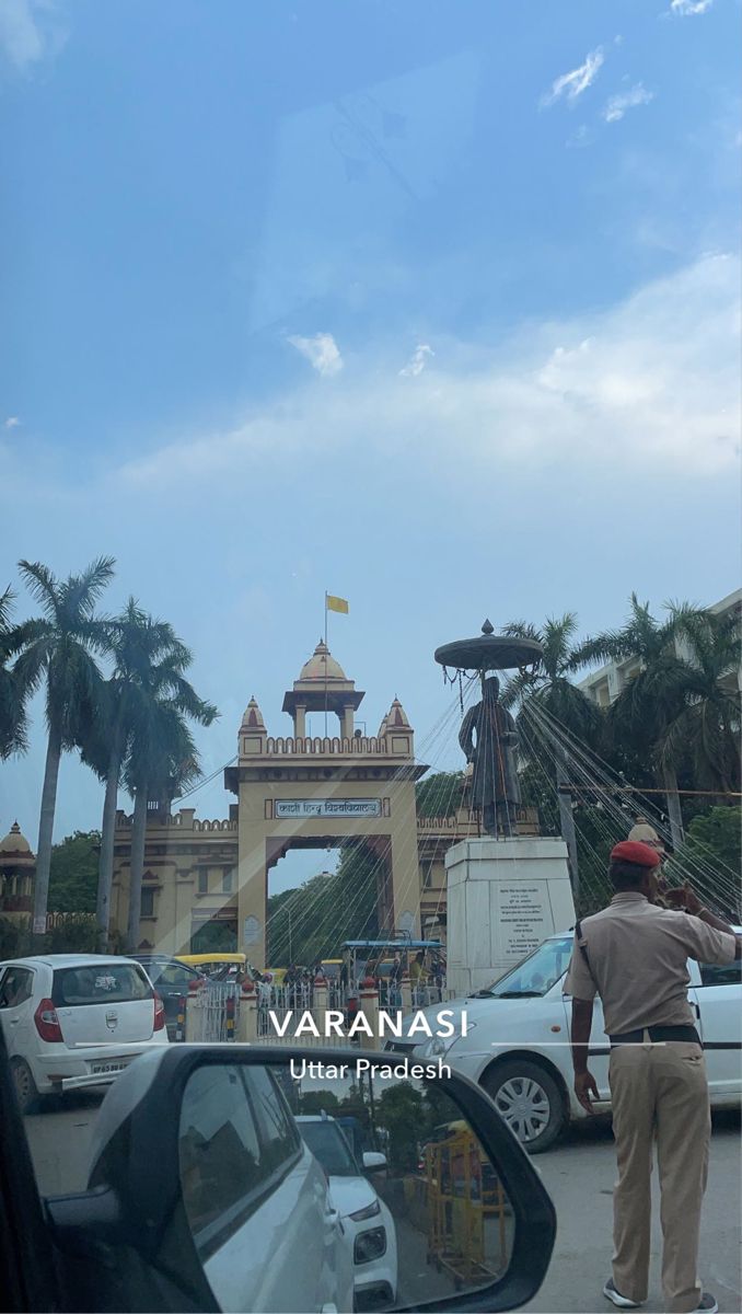 there is a man standing in front of the entrance to varanasi