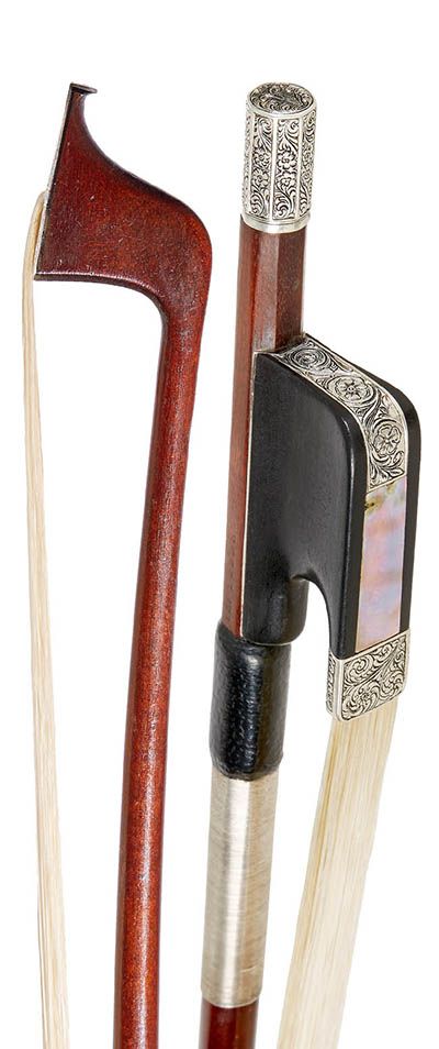 an assortment of different types of wood and metal items in a holder on a white background