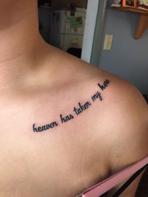 the back of a woman's shoulder with an inscription on it that reads,