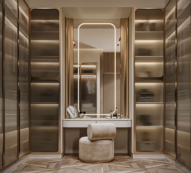 an elegant bathroom with mirrored walls and marble flooring, along with a stool in front of the mirror