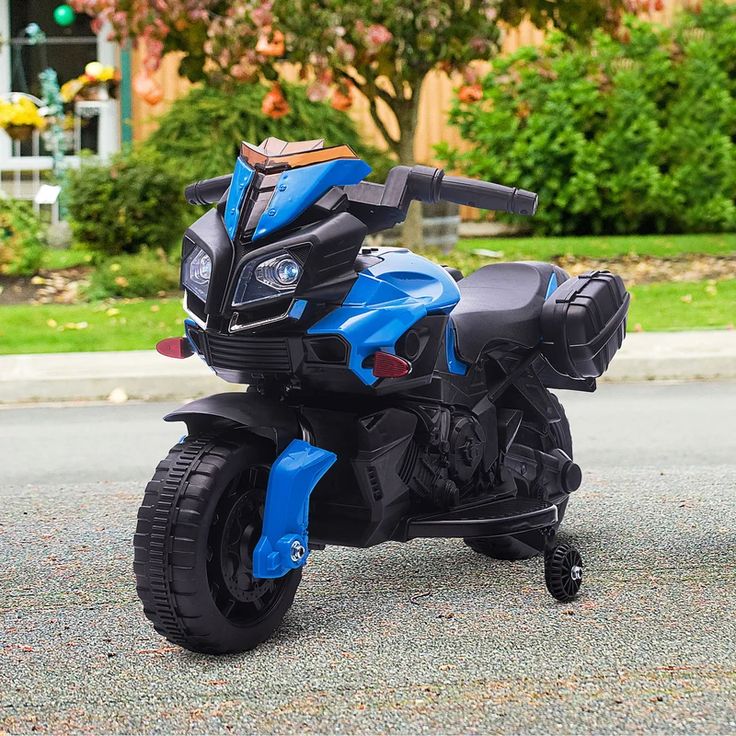 a toy motorcycle is parked on the street