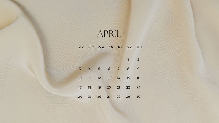 the back side of a white sheet with an embroidered calendar on it