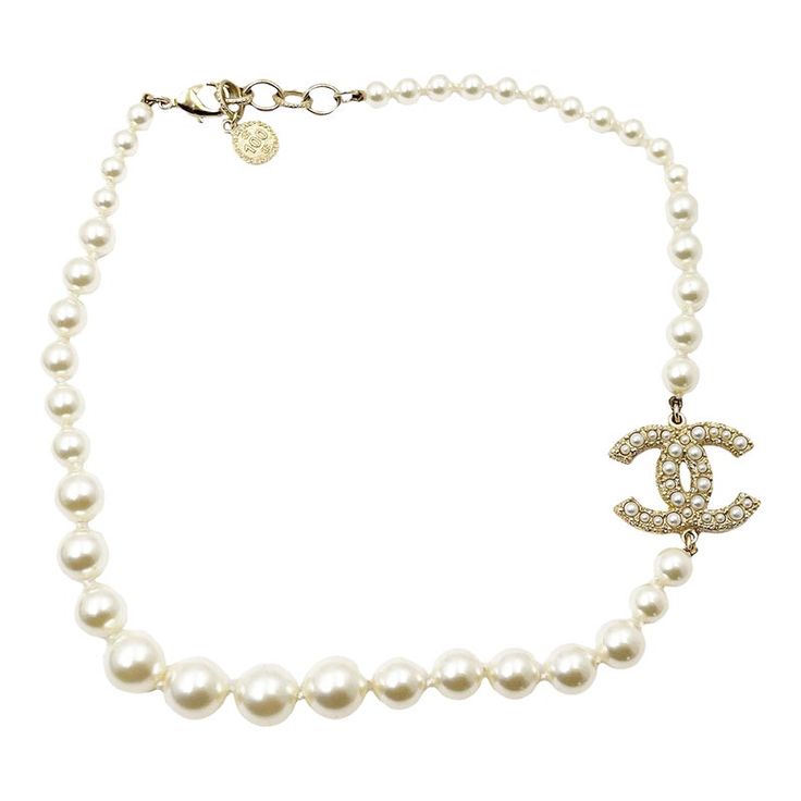 Chanel Gold CC Pearl Short Pearl Necklace 100 Year Anniversary  *Marked 21 *Made in France-It is approximately 18" long.  -The cross pendant is approximately 1.1" x 0.9". -100 year anniversary Gold Pearl Jewelry Necklace Tiffany & Co., Pearl Necklace Chanel, Formal White Gold Necklace With Logo Charm, Elegant White Jewelry With Logo Charm, White Formal Jewelry With Logo Charm, Formal White Jewelry With Logo Charm, Classic Round Necklace With Logo Charm, Elegant White Necklace With Logo Charm, Luxury Single Strand Pearl Pendant Necklace