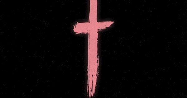 a pink cross on a black background