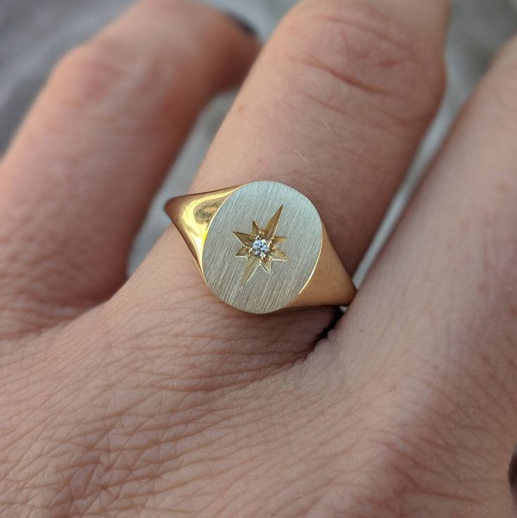 Our solid gold starburst signet ring features a cosmic star set with a sparkling diamond. Choose from 14k, 18k yellow, rose, white gold or platinum. Prefer a colored gemstone in place of the diamond? Just leave us a note at checkout. This ring is a lovely addition to your celestial fine jewelry, and makes a meaningful, timeless (and cool!) gift for your loved ones this holiday season. Details: - Made at our family-run studio in NYC. - Solid 14k, 18k yellow, rose, white gold or platinum -- choose Celestial Yellow Gold Diamond Ring In Star Shape, Celestial Star-shaped Yellow Gold Diamond Ring, Celestial Yellow Gold Star-shaped Diamond Ring, Yellow Gold Star-shaped Signet Ring For Anniversary, Gold Star-shaped 14k Diamond Ring, Star-shaped Yellow Gold Diamond Ring, Celestial Diamond Jewelry With Single Diamond, Celestial White Gold Jewelry With Single Diamond, Celestial Style Single Diamond Ring