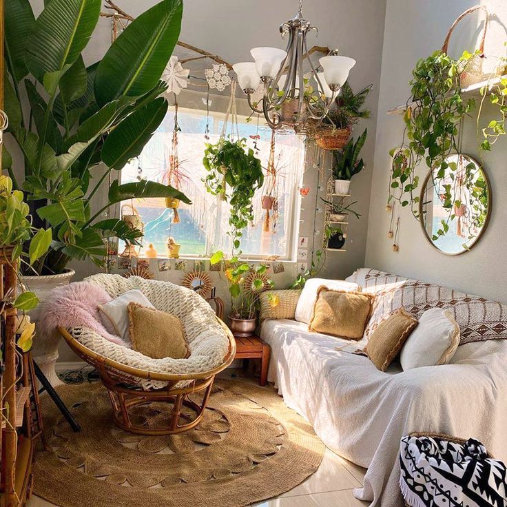 a living room filled with furniture and lots of plants