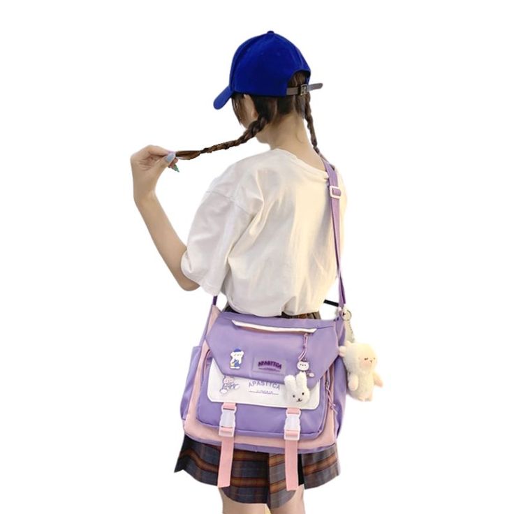 This cute korean messenger bag will appeal to all women who are looking for an original bag to carry all their daily stuff with them. With its original and fun design in the colors of K-pop, discover this beautiful shoulder bag in tribute to Korean culture. Discover this beautiful cute korean messenger bag If you're looking for a medium messenger bag to store all the things you care about, you'll love this cute korean messenger bag. Available in blue and pink, lavender and black and white, this Cute Satchel Shoulder Bag With Adjustable Strap, Trendy School Bag With Detachable Strap, Trendy School Bags With Detachable Strap, Cute Shoulder Bag Backpack With Phone Bag, Cute Shoulder Backpack With Phone Bag, Cute School Shoulder Bag, Cute School Shoulder Bag With Adjustable Strap, Cute Shoulder Backpack With Mobile Phone Bag, Cute Crossbody Shoulder Bag For School