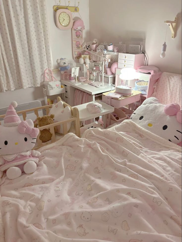 a bedroom with hello kitty bedding and toys