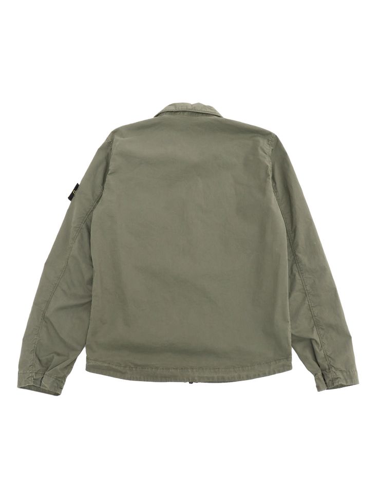 Military green denim jacket with classic collar, front zip, front pocket, logo plate on the sleeve.Composition: 97% COTTON 3% ELASTANE Military Style Cotton Utility Jacket, Green Military Utility Jacket For Streetwear, Military Style Cotton Utility Jacket With Button Closure, Stone Island Kids, Cotton Military Utility Jacket, Military Utility Jacket With Patch Pockets For Outdoor, Green Denim Jacket, Stone Island Junior, Pocket Logo