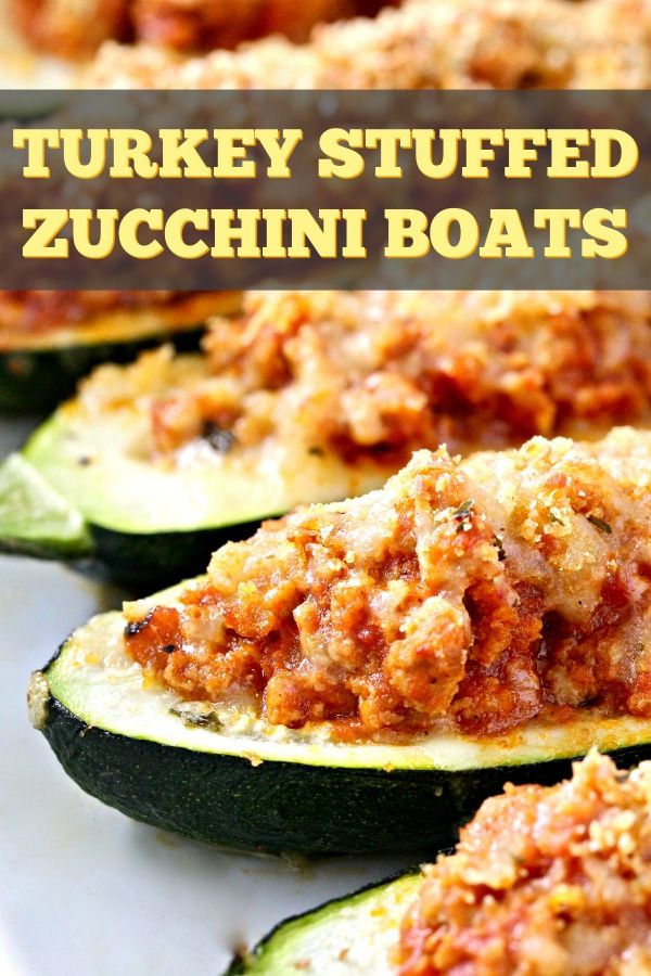 stuffed zucchini boats on a white plate with text that reads turkey stuffed zucchini boats