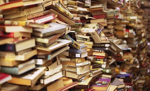 a pile of books with the words books = life