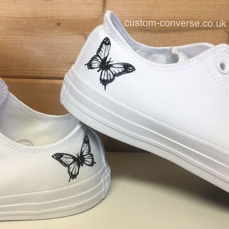 Plain white converse trainers hand painted with a black and white butterfly design. Simple, elegant and classic, these would make a gorgeous spring summer or wedding shoe design. #converse #butterfly #weddingshoes #shoes #sneakers #handpainted #bride #white #springstyle #summer #fashion #womensfashion #womenshoes #cuteshoes #trainers #customconverse #customsneakers #customshoes White Converse Designs, White Converse Drawing On Shoes, Shoes Painting Ideas Converse, White Converse Custom Art, Butterfly Painted Shoes, Custom Converse High Tops Butterfly, Sharpie Shoes, Converse Style Women, Low Top Converse