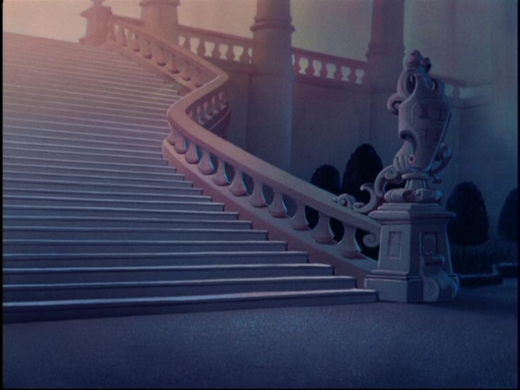 an ornate staircase with railings leading up to the top