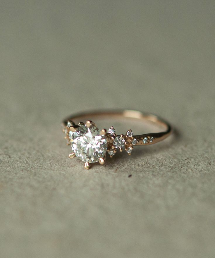 an engagement ring with three stones on it