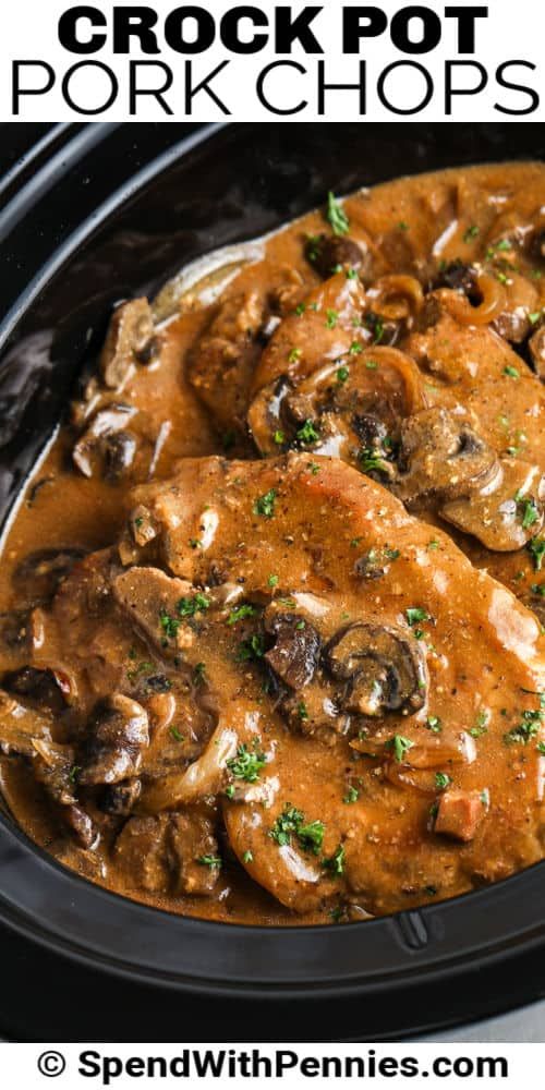 crock pot pork chops with mushrooms and gravy in a slow cooker