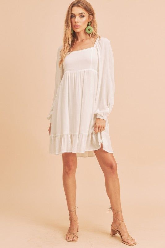 Get your twirl on in our airy textured Taya Dress with a square neckline, tiered through skirt, finished with puff sleeves and smocked back.Fabric Contents: 100% RayonSize Measurement (inch): S: 15.5 (Bust), 13.5 (Waist), 16.5 (Hips), 33.5 (Length) M: 16.0 (Bust), 14.0 (Waist), 17.0 (Hips), 34.0 (Length) Flowy Square Neck Mini Dress For Daywear, Square Neck Mini Dress With Ruffle Hem For Daywear, Flowy Smocked Dress With Bodice And Square Neck, Flowy Smocked Dress With Square Neck And Smocked Bodice, Elegant Puff Sleeve Dress With Tiered Skirt For Brunch, Chic Square Neck Smocked Dress For Daywear, Casual Billowy Dress With Square Neck, Square Neck Smocked Dress For Day Out, Elegant Smocked Dress With Square Neck For Day Out