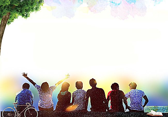 four people sitting on a bench under a tree with their arms up in the air