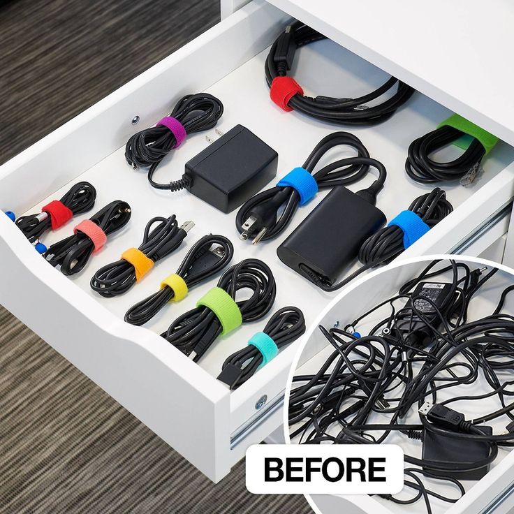 the drawer is filled with many different cords and plugs for charging phones or other electronic devices