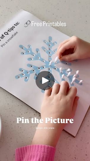 a person is making a snowflake out of paper