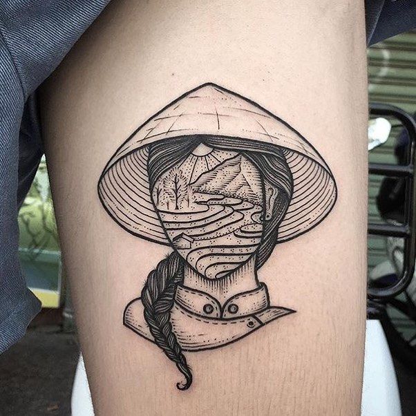 a woman's thigh with a hat on it