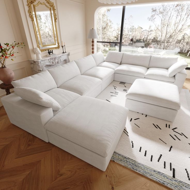 a large white sectional couch in a living room