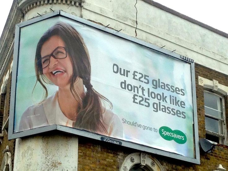 an advertisement on the side of a building for eyeglasses is shown in english