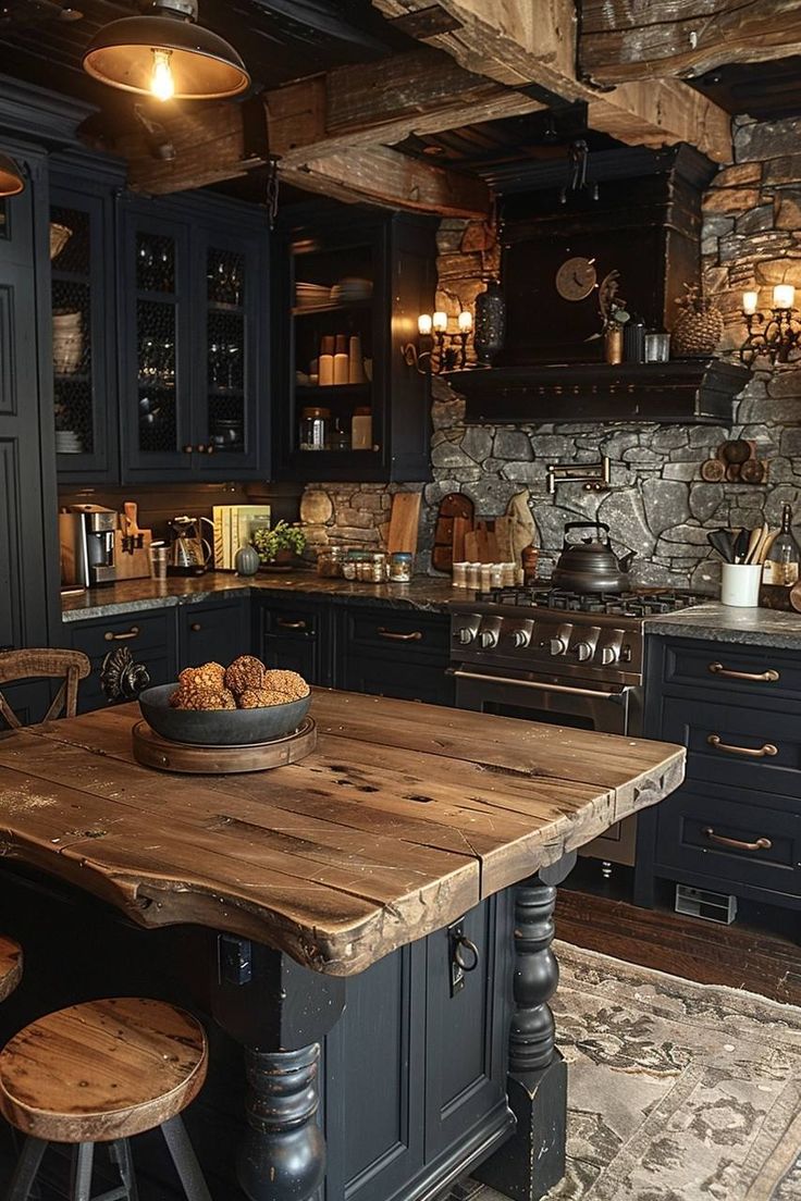 a rustic kitchen with black cabinets and an island made out of wooden planks in the center