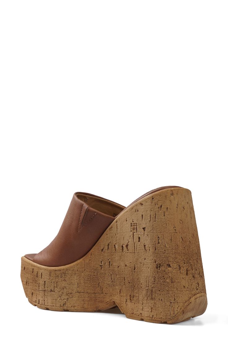 A cork-textured wedge heel adds textural edge to an old-school sandal topped with a smooth leather strap. 5" heel; 2" platform Leather upper and lining/synthetic sole Imported Platform Cork Wedge Sandals For The Beach, Cork Wedge Heels With Platform, Cork Platform Open Toe Heels, Cork Platform Heels With Open Toe, Open Toe Cork Wedge Sandals With Platform, Platform Cork Wedge Heels, Cork Platform Wedge Heels, Casual Cork Platform Wedge Sandals, Brown Cork Wedge Sandals For Summer