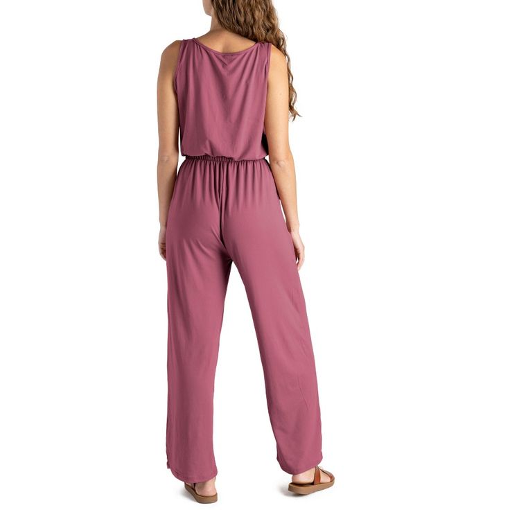 Made from super soft, lightweight stretchy fabric, this jumpsuit is designed to be worn for any season or occasion, making it a staple in your wardrobe. The flattering relaxed fit and wide-leg style with side pockets add a touch of casual sophistication, while the open V-neck and elastic waistband with a drawstring tie create a flattering silhouette that complements any body type. Dress it down with your favorite sandals for a laid-back daytime look or dress it up with wedges and sparkling state Versatile Solid Jumpsuits And Rompers With Pockets, Versatile Jumpsuits And Rompers With Pockets, Casual Sleeveless Jumpsuits And Rompers For Lounging, Spring Solid Jumpsuits And Rompers With Side Pockets, Spring Solid Color Jumpsuits And Rompers With Side Pockets, Solid Jumpsuits And Rompers With Side Pockets For Spring, Versatile Jumpsuits And Rompers With Pockets For Loungewear, Beach Jumpsuits And Rompers With Elastic Waistband, Casual Sleeveless Jumpsuits And Rompers With Elastic Back