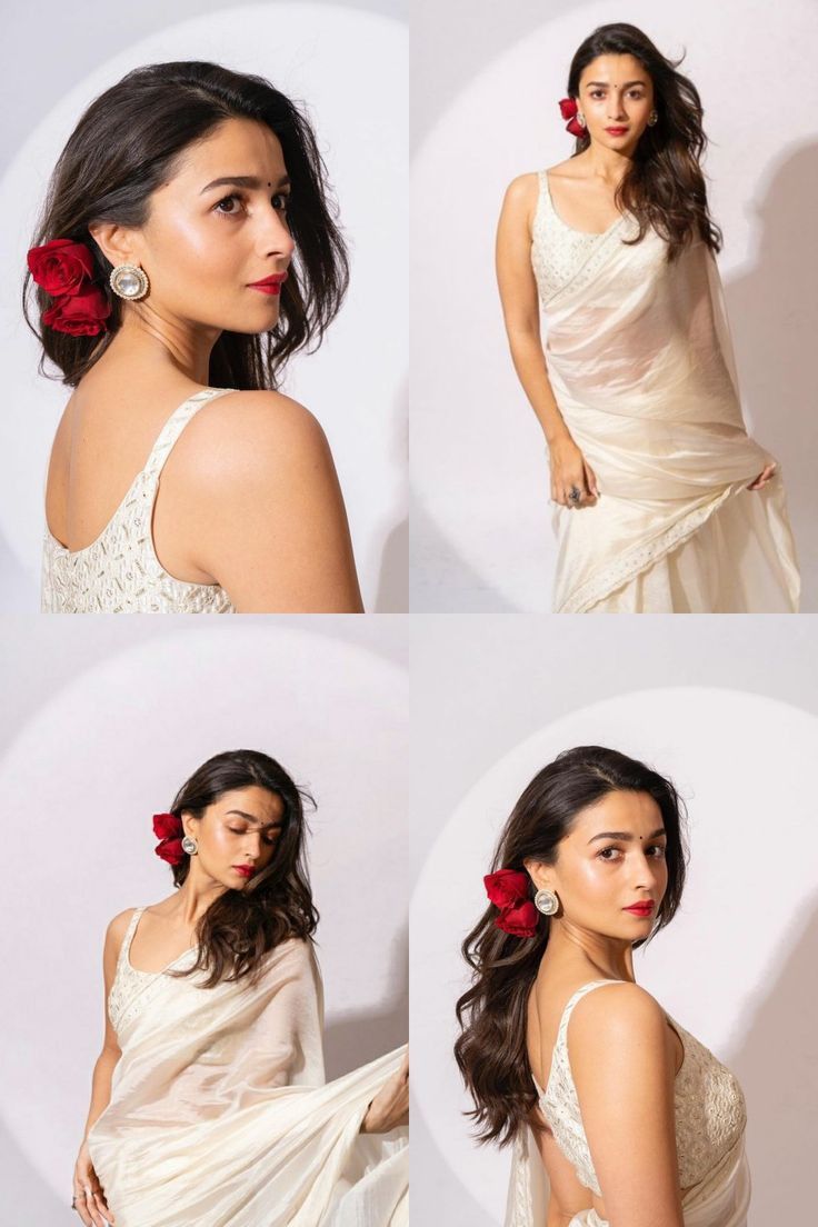 a woman in a white dress with red flowers on her hair and wearing a flower in her hair