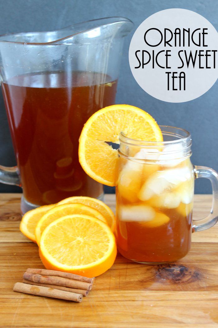 orange spice sweet tea in a pitcher and sliced oranges