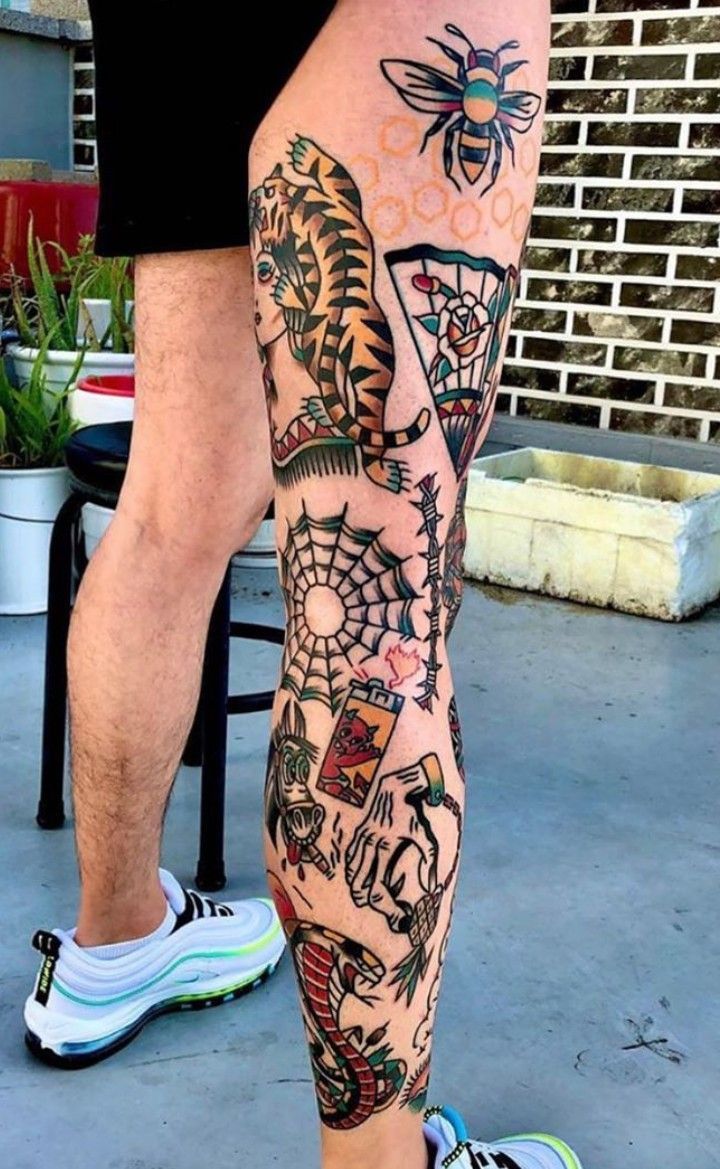 a man with tattoos on his legs and leg