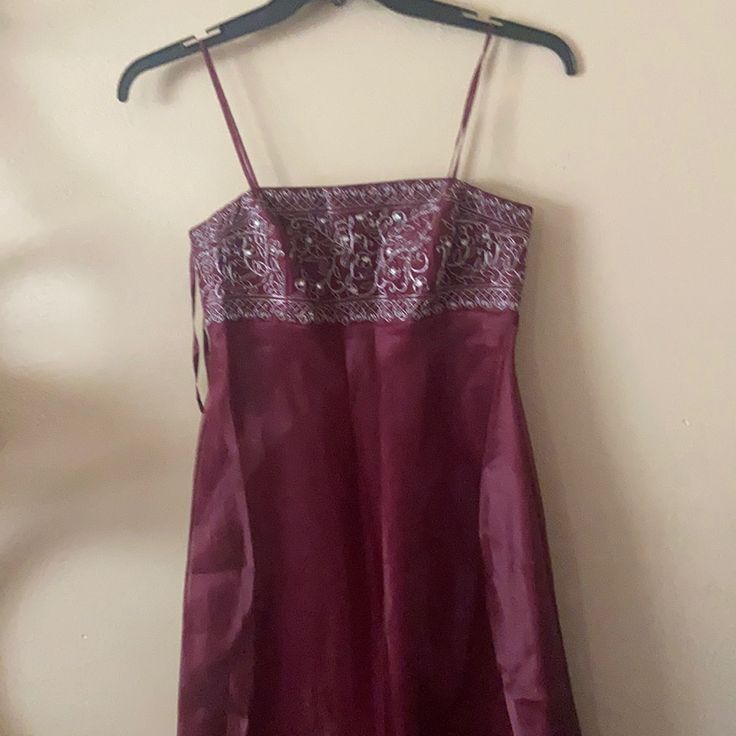 a dress hanging up on a hanger