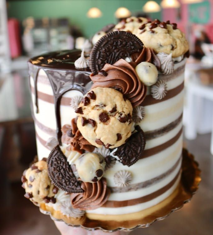 there is a cake with cookies and chocolate chips on it