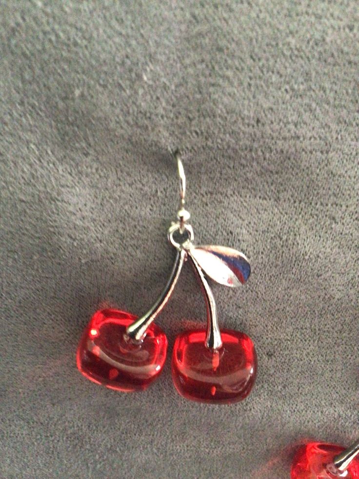 "(7018) Cherries necklace and earrings  Cherries are silver alloy and resin, 1 1/8\" x 1 1/8\". Earrings are on silver plate ear wires. Necklace is on sterling silver chain, 18\"." Resin Drop Earrings With Ear Wire, Glass Drop Earrings For Gift, Silver Czech Glass Jewelry With Matching Earrings, Silver Glass Jewelry For Party, Sterling Silver Ear Wire Jewelry For Party, Party Jewelry In Silver With Glass Material, Elegant Resin Dangle Jewelry, Elegant Dangle Resin Jewelry, Silver Drop Earrings Costume Jewelry