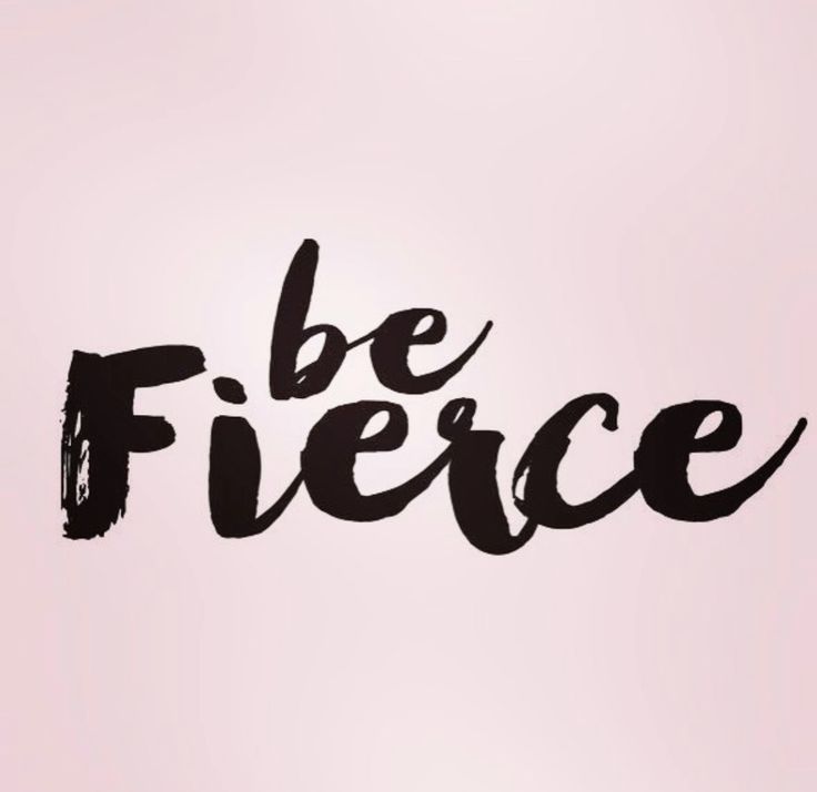 the word be fierce written in black ink on a light pink background with brush strokes