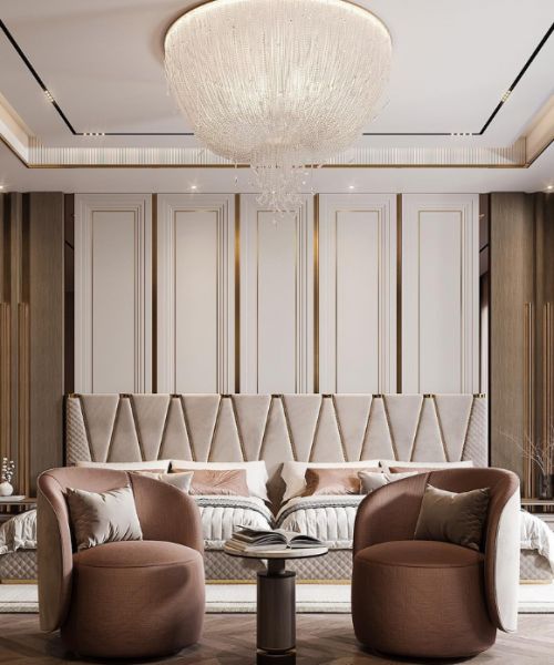 a living room with two chairs and a couch in front of a chandelier