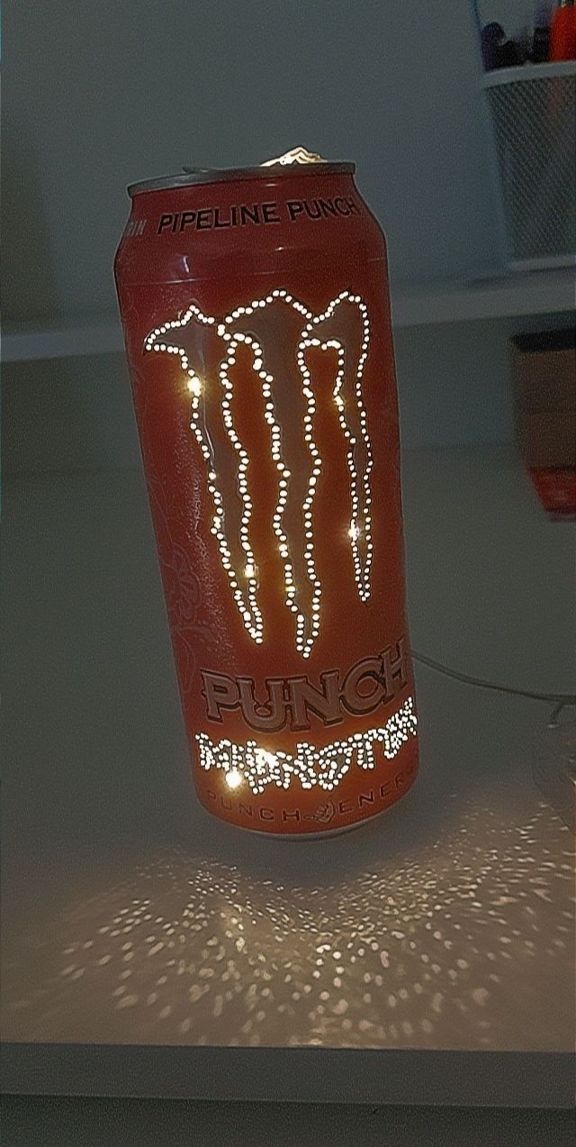 a can with lights on it sitting on a table